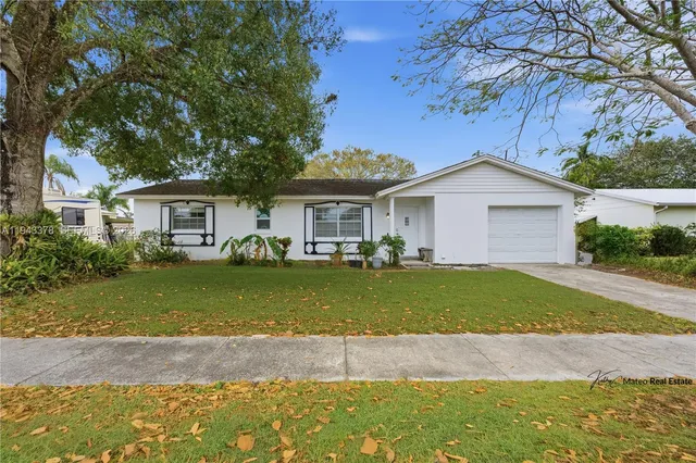 a front view of a house with a garden and porch