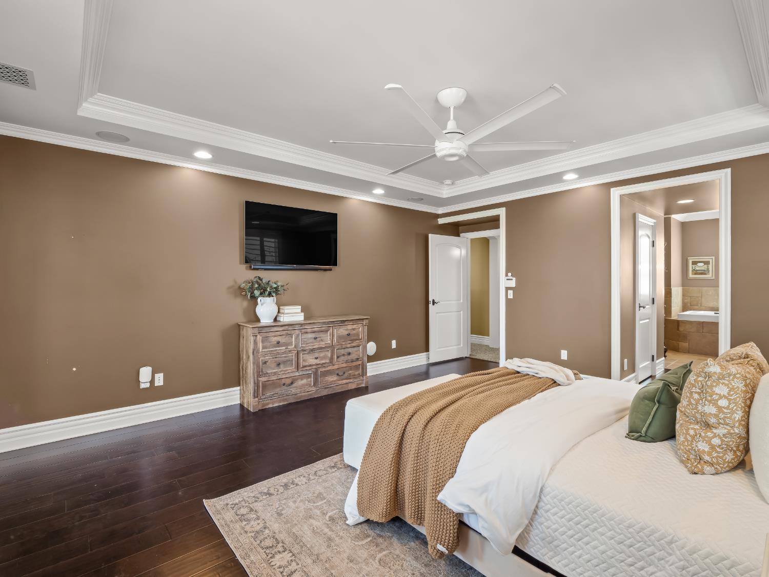 17113 Mark Road Madera, CA 93636 - Photo 31 of 99 a bedroom with a bed and a flat screen tv