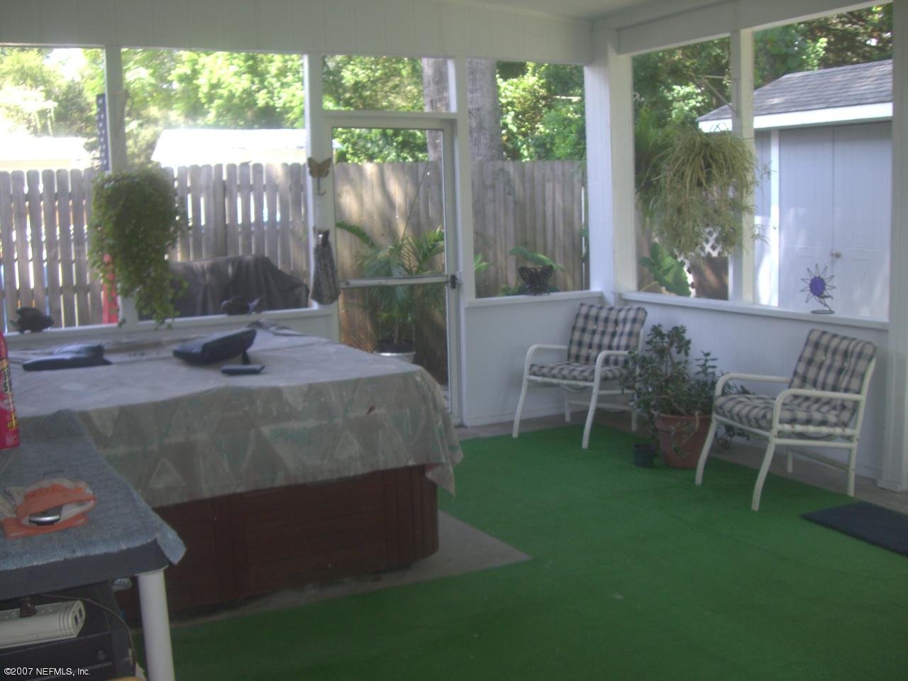 6533 Ector Road Jacksonville, FL 32211 - Photo 8 of 11 a view of a chair and table in backyard of the house