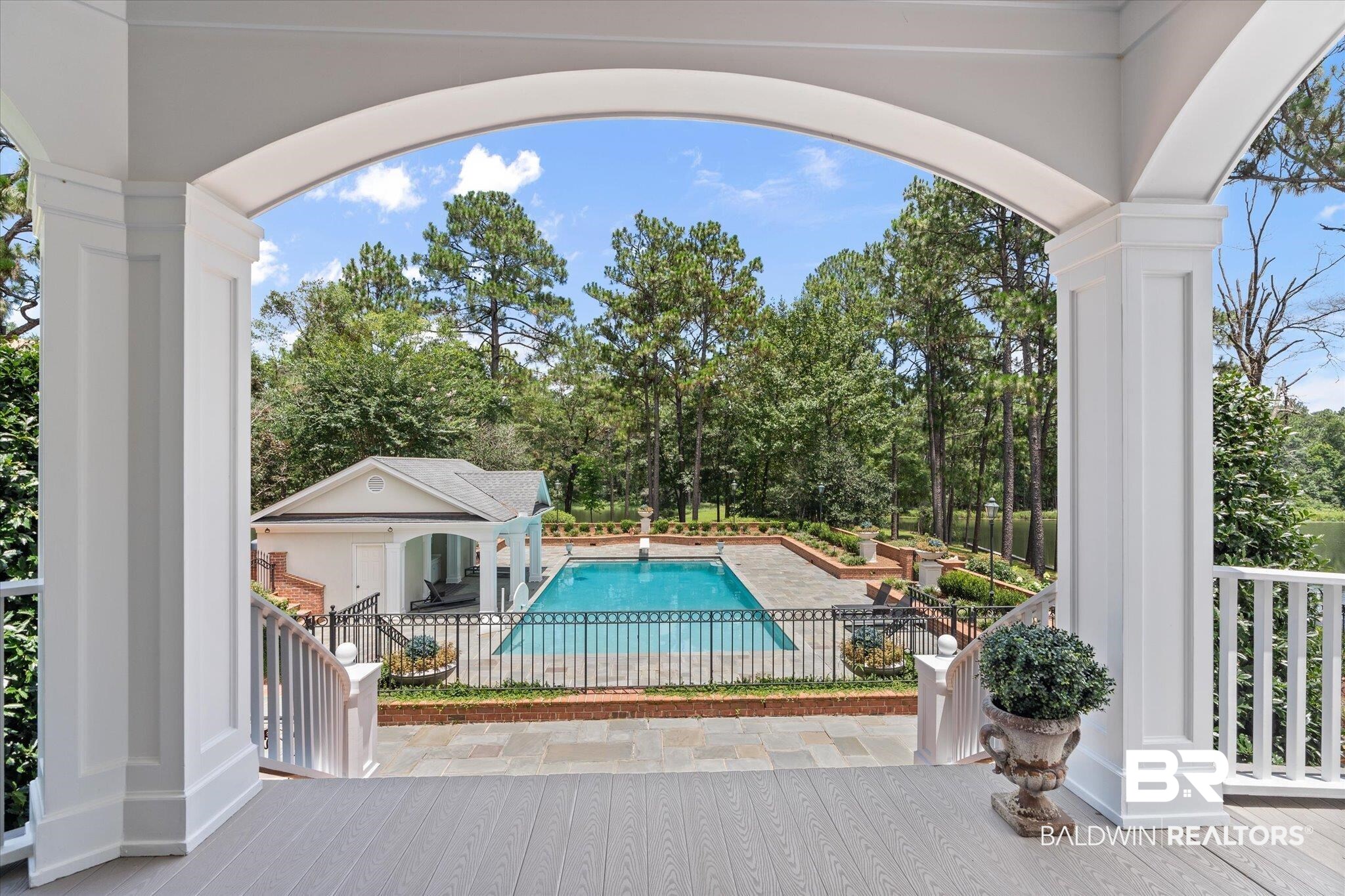 8561 Dawes Lake Road Mobile, AL 36619 - Photo 41 of 63 View of pool with a patio area and view of wooded area