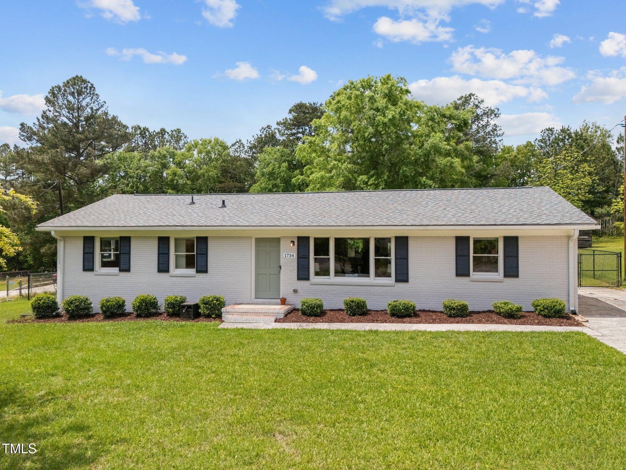 1734 Stage Road Durham, NC 27703 - Photo 1 of 33 1-web-or-mls-DJI_20250425132314_0031_D