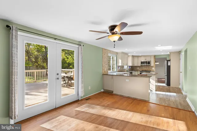 a view of a kitchen with a sink and a window