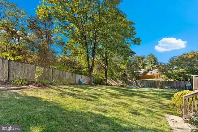 a view of a backyard with plants and a patio