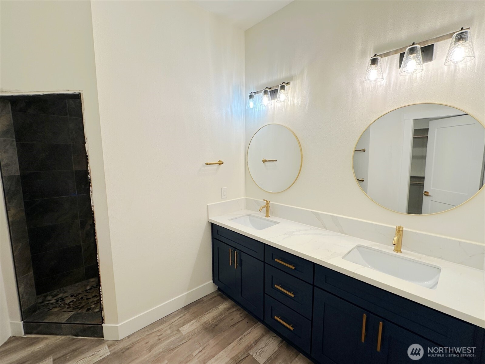 559 Upper Naselle Road Naselle, WA 98638 - Photo 22 of 32 a bathroom with double vanity sink and a mirror