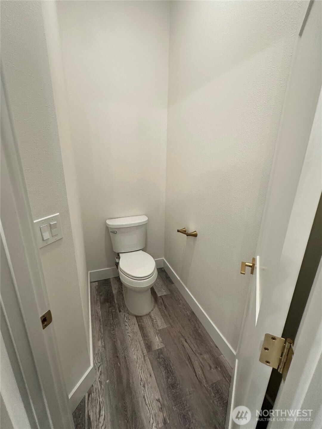 559 Upper Naselle Road Naselle, WA 98638 - Photo 25 of 32 a white toilet sitting next to a white sink and vanity