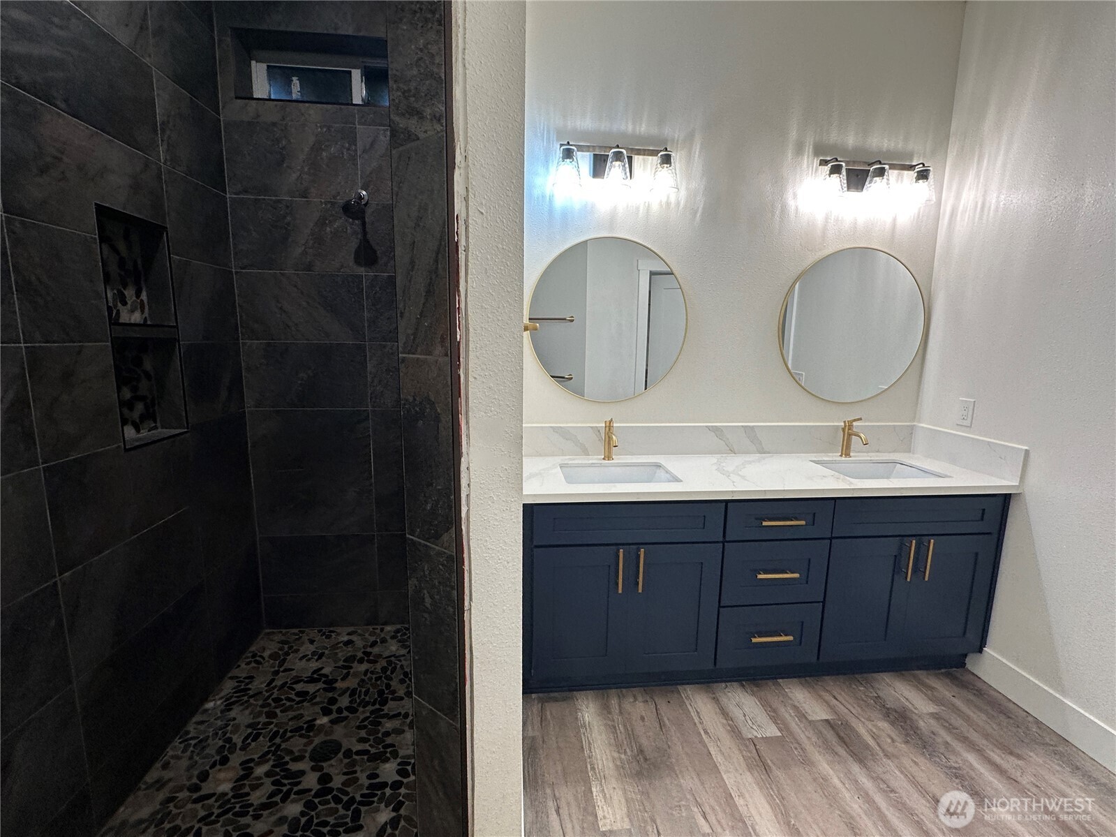 559 Upper Naselle Road Naselle, WA 98638 - Photo 26 of 32 a bathroom with a sink vanity and a mirror