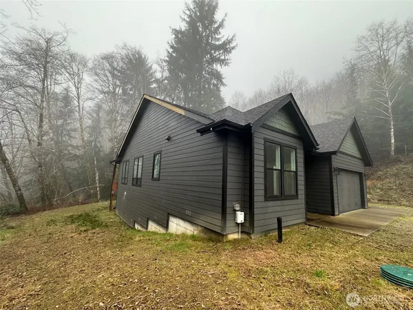 a house with trees in the background