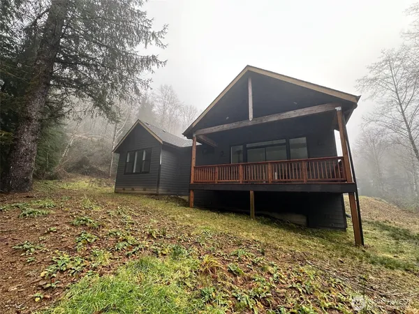 a view of house with backyard