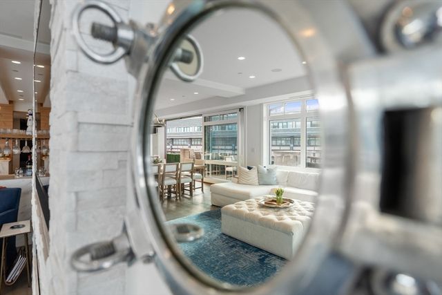 a living room with a large window and a table