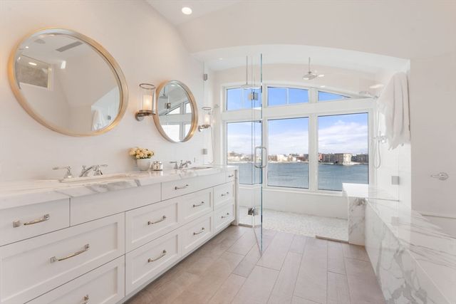 a bathroom with a double vanity sink and a mirror