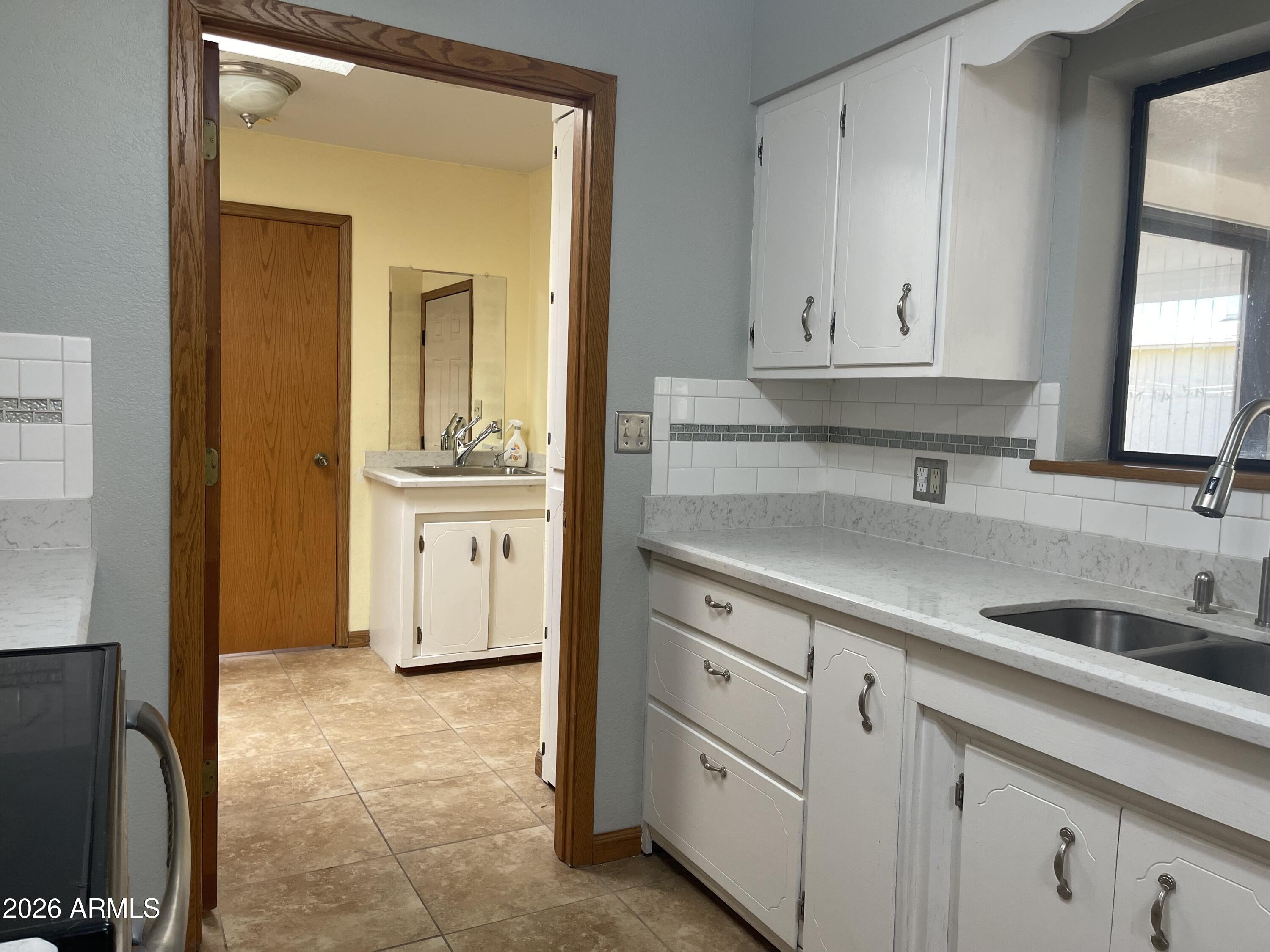 14555 South Acapulco Road Arizona City, AZ 85123 - Photo 18 of 46 Laundry with sink and storage