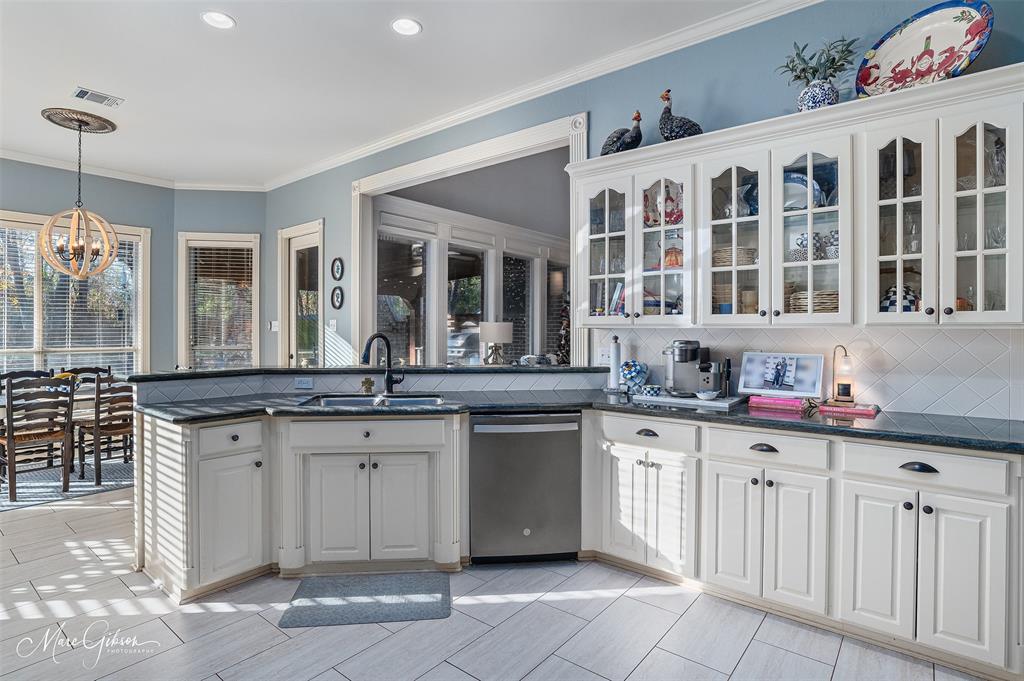 1310 Bay Ridge Drive Bossier City, LA 71111 - Photo 12 of 37 a kitchen with a sink stove and cabinets