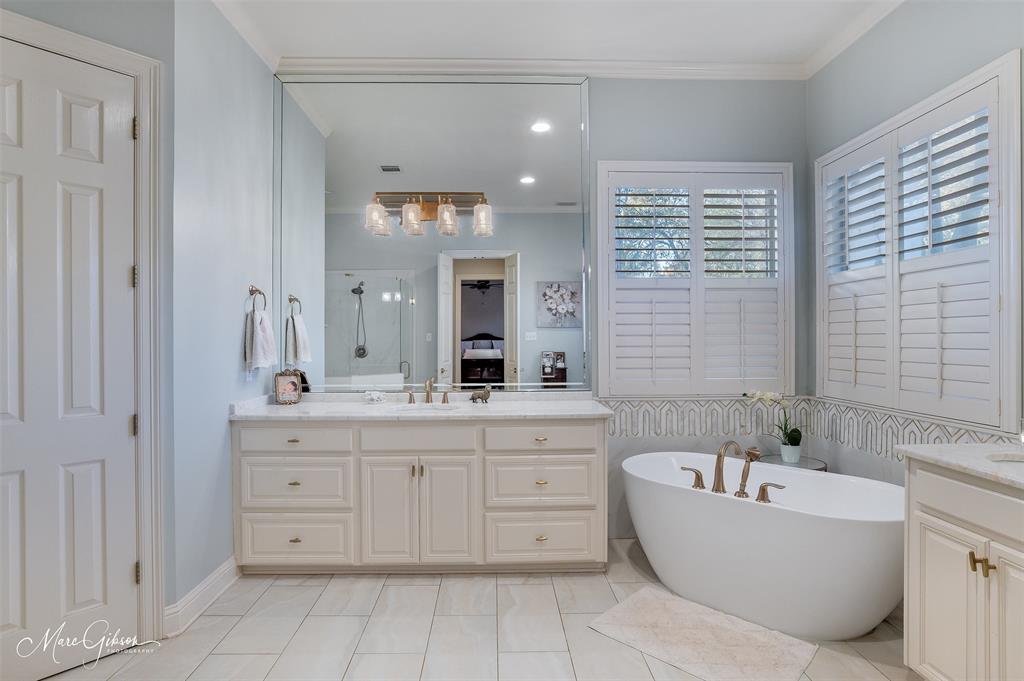 1310 Bay Ridge Drive Bossier City, LA 71111 - Photo 22 of 37 a spacious bathroom with a tub sink and mirror
