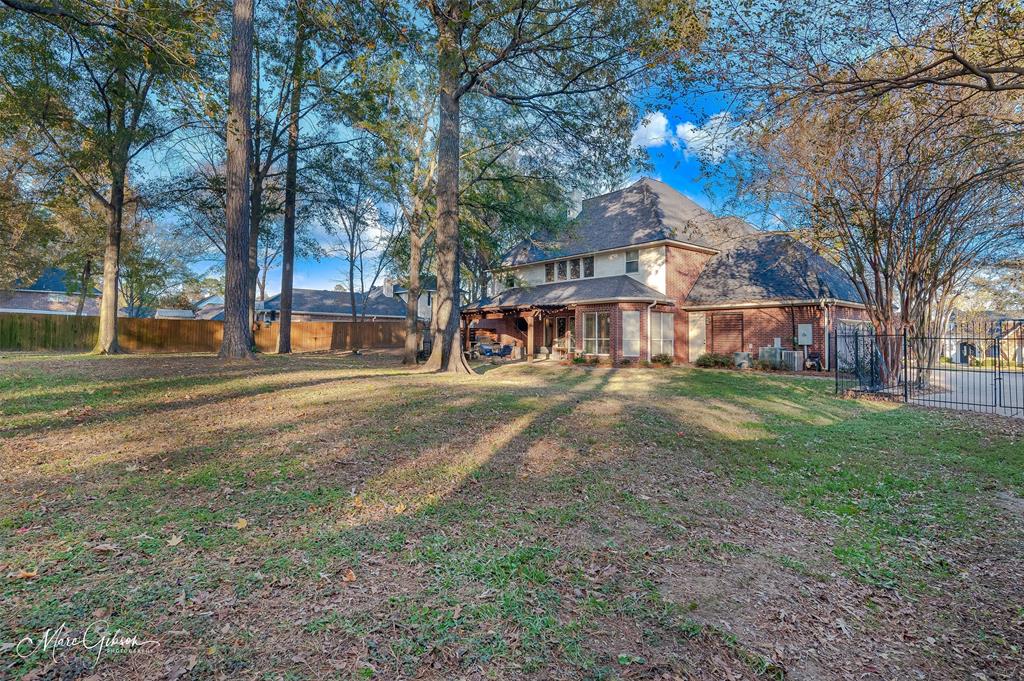 1310 Bay Ridge Drive Bossier City, LA 71111 - Photo 34 of 37 a view of a house with a yard