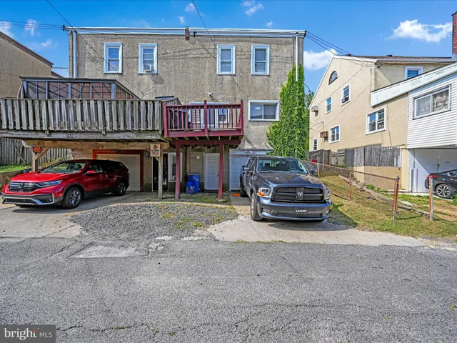 a view of a car parked in front of a house