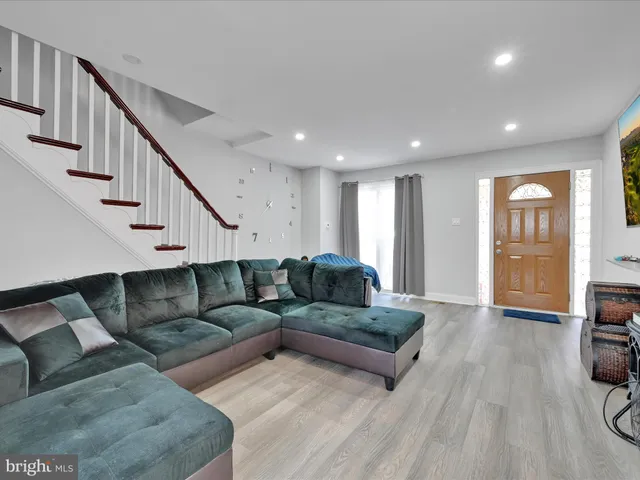 a living room with furniture and a table