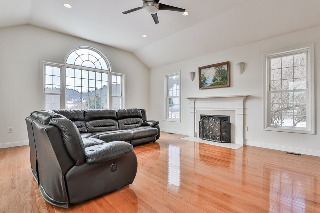 218 Littleton County Road Harvard, MA 01451 - Photo 17 of 41 a living room with furniture and a fireplace