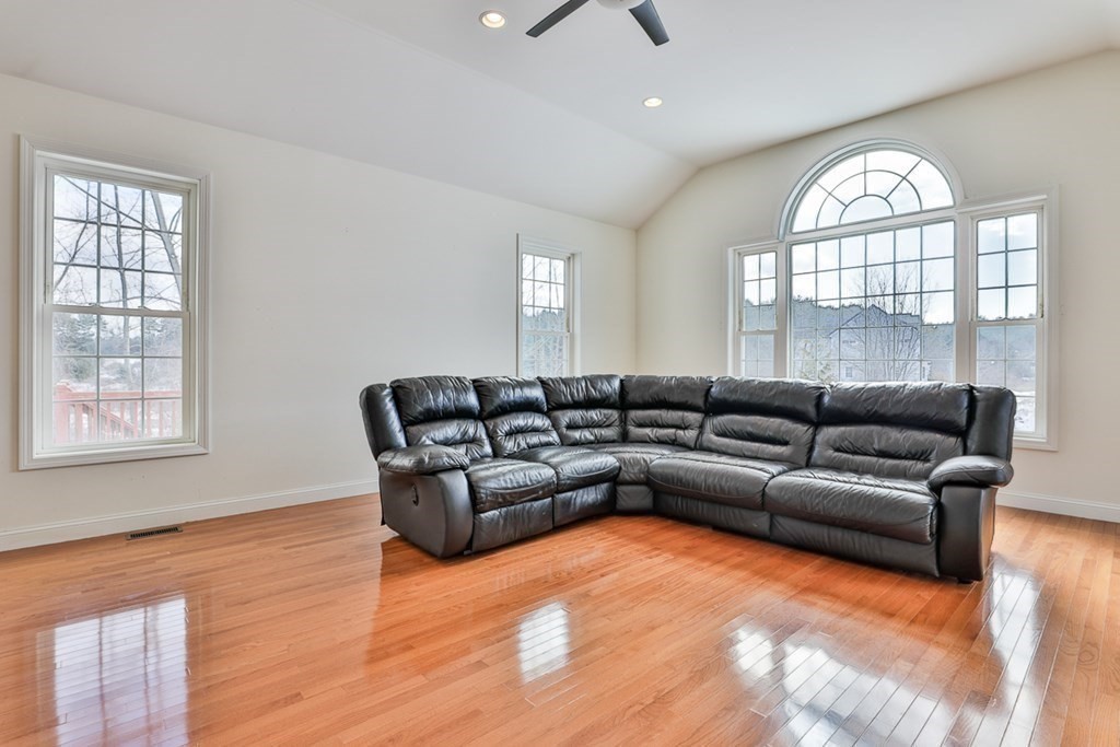 218 Littleton County Road Harvard, MA 01451 - Photo 18 of 41 a living room with furniture and a large window