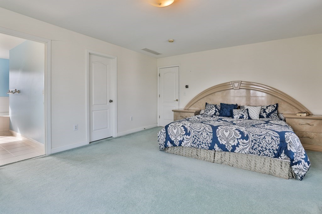 218 Littleton County Road Harvard, MA 01451 - Photo 29 of 41 a bedroom with a bed and a window