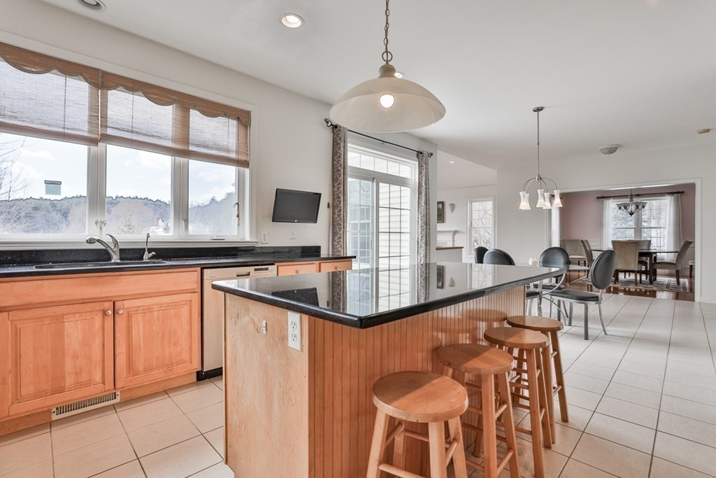 218 Littleton County Road Harvard, MA 01451 - Photo 8 of 41 a very nice looking kitchen with granite countertop a large window