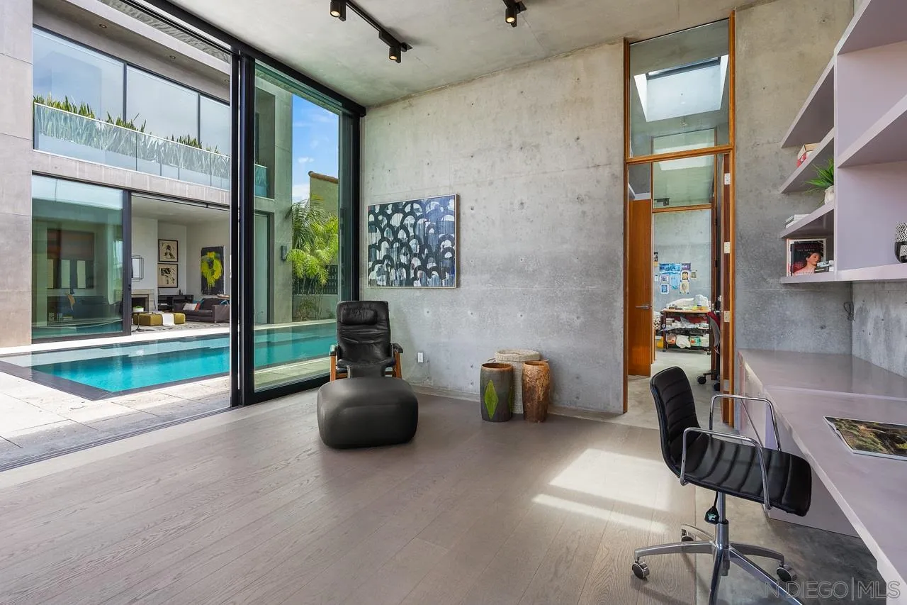 1228 Park Row La Jolla, CA 92037 - Photo 15 of 35 a living room with furniture and a floor to ceiling window