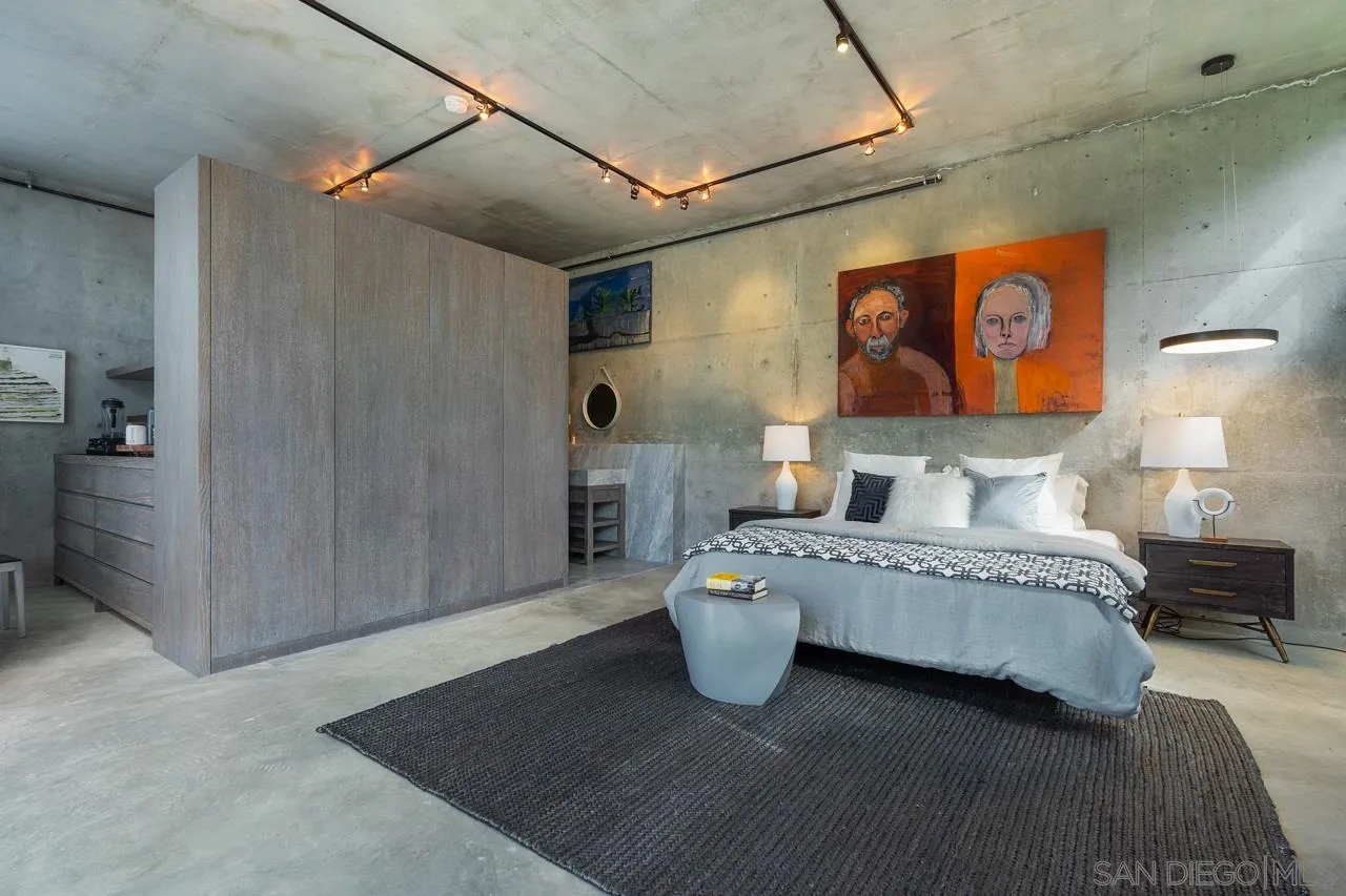 1228 Park Row La Jolla, CA 92037 - Photo 28 of 35 a spacious bedroom with a bed and a table