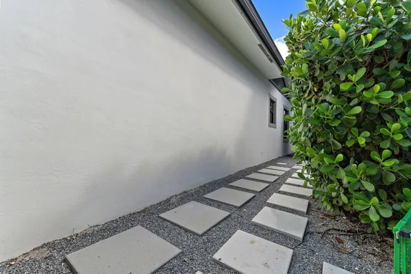 an aerial view of a house with a yard basket ball court and outdoor seating