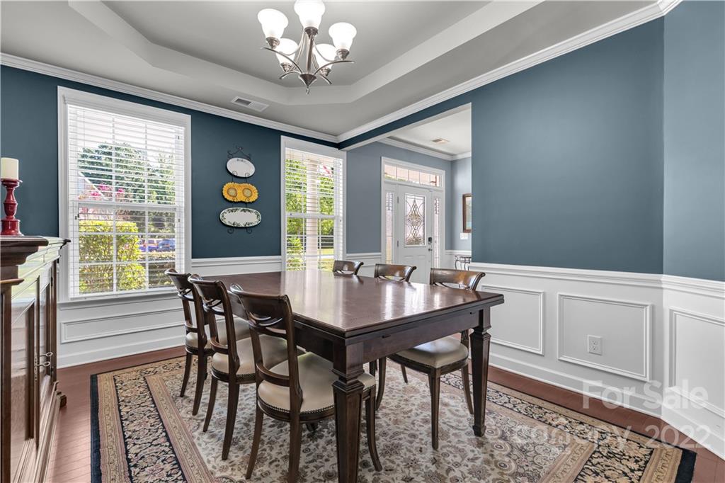 948 Solandra Way Tega Cay, SC 29708 - Photo 5 of 48 a view of a dining room with furniture and a chandelier