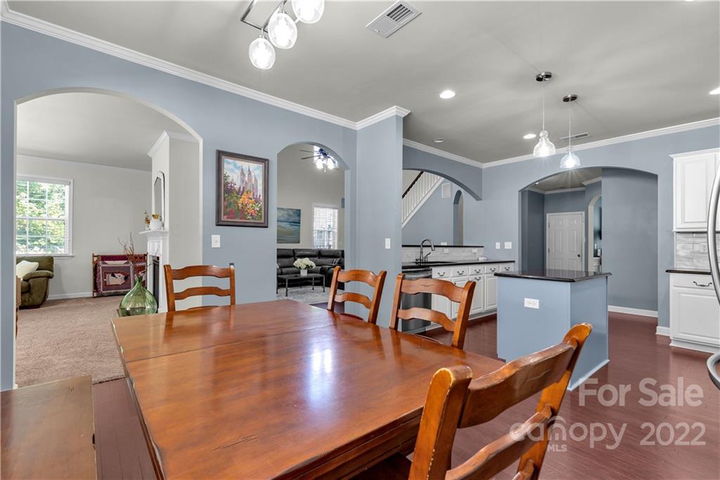 948 Solandra Way Tega Cay, SC 29708 - Photo 9 of 48 a living room with furniture and a dining table