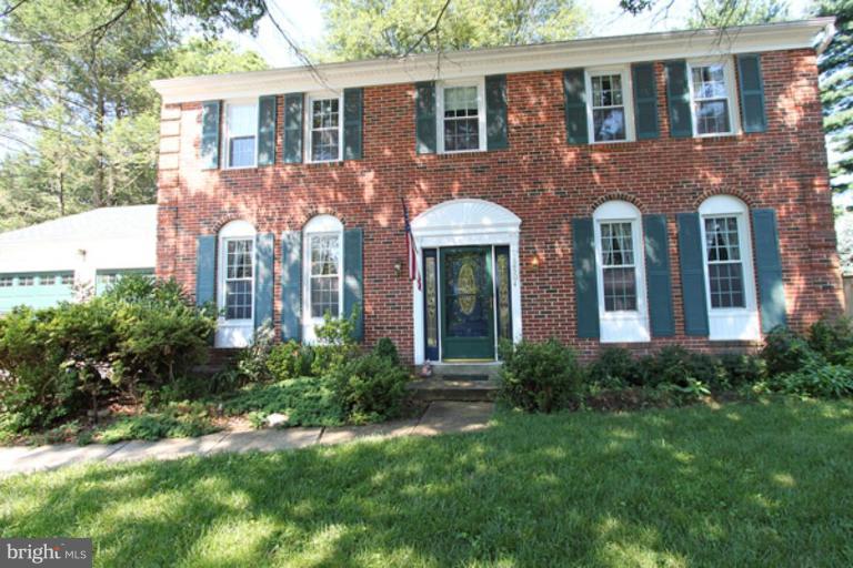 12504 Arbor View Terrace Silver Spring, MD 20902 - Photo 1 of 18 a front view of a house with yard and green space