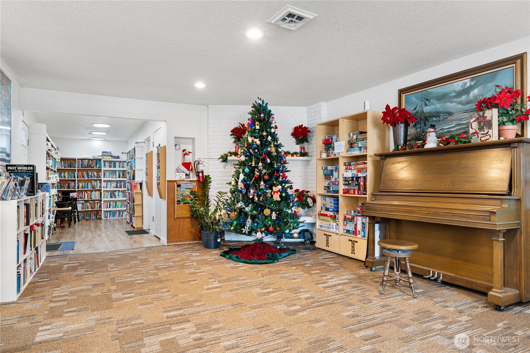 23825 15th Avenue Southeast, Unit 40 Bothell, WA 98021 - Photo 30 of 39 a room with lots of books and a large window
