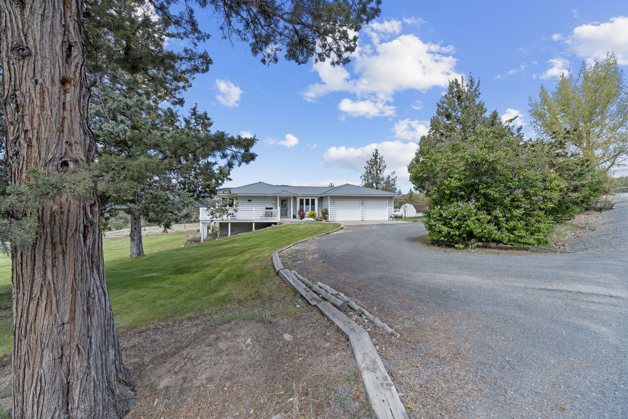 17722 Pope Road Merrill, OR 97633 - Photo 8 of 61 a front view of a house with garden