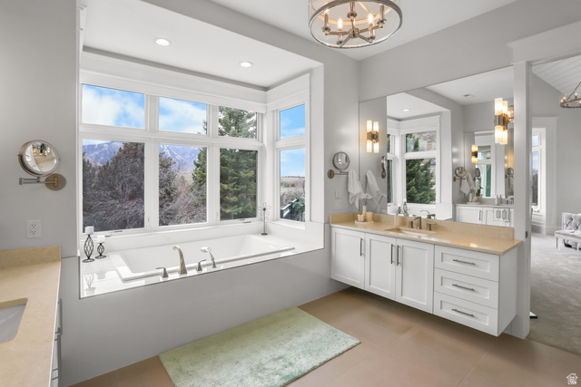 1354 South 800 East Mapleton, UT 84664 - Photo 8 of 129 Bathroom with vanity, hanging lights, a bath, light tile patterned flooring, and light colored carpet