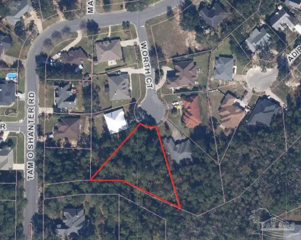 an aerial view of residential house with outdoor space and trees all around