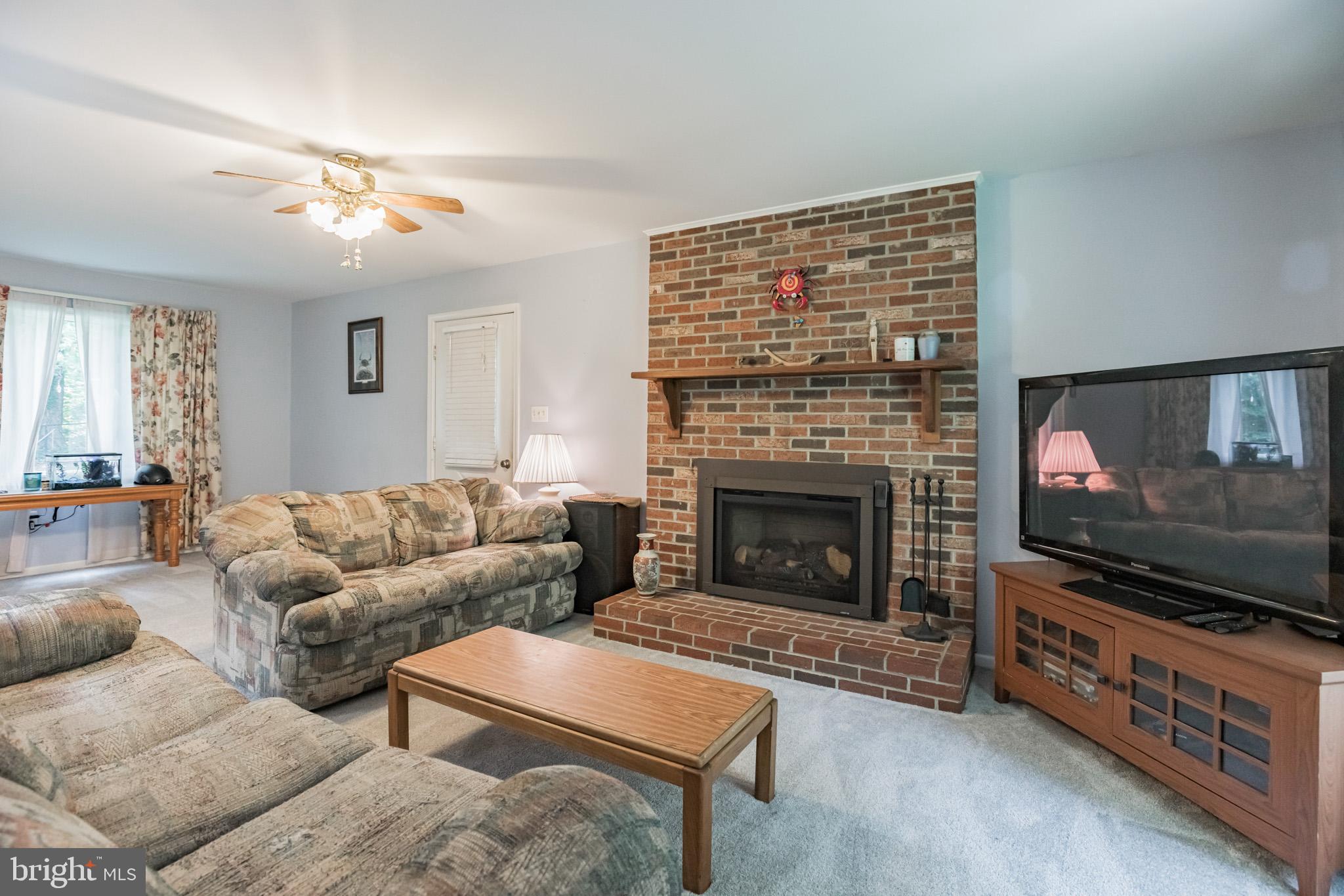 3750 Spruce Road Port Republic, MD 20676 - Photo 2 of 29 Family room with propane fireplace