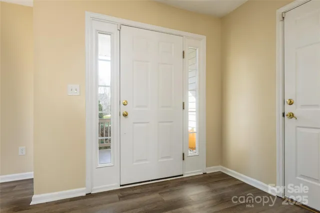 an empty room with wooden floor