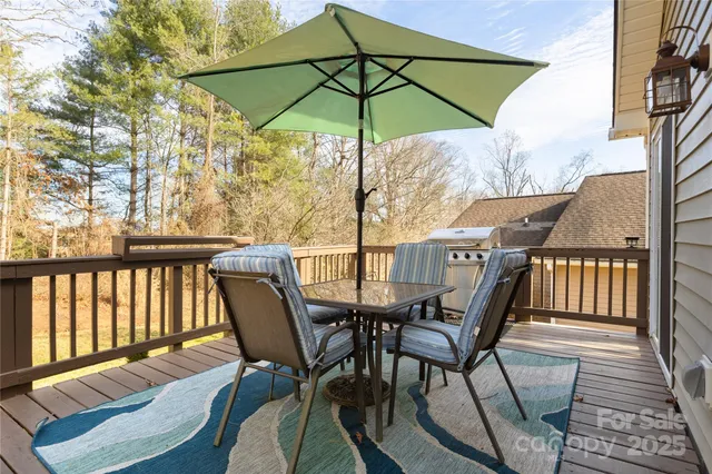 a view of a chairs and table in the balcony