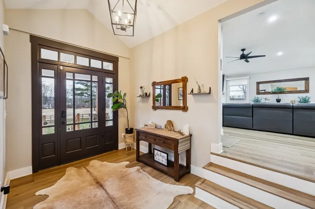 a living room with furniture and kitchen view
