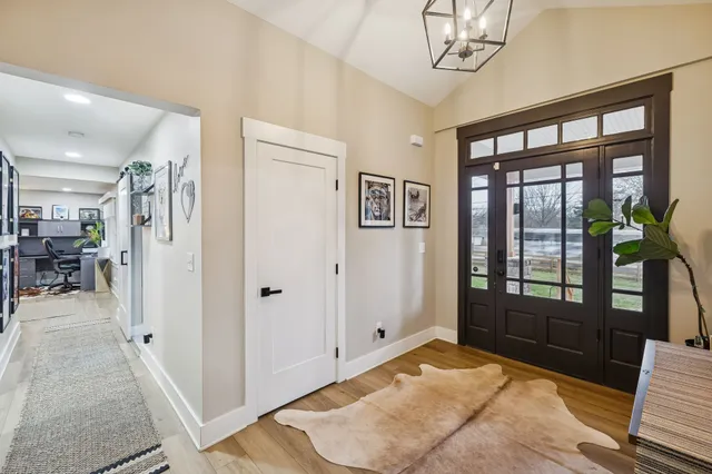 a bathroom with double vanity sink and a mirror