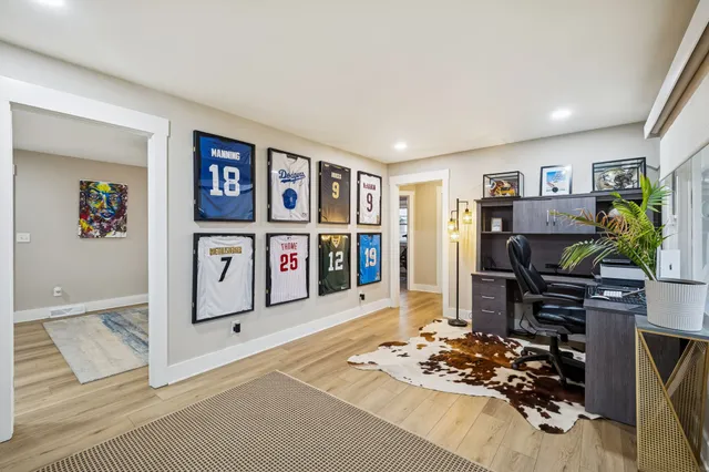 a bedroom with a large bed and a window