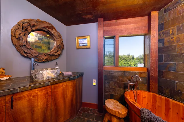 a bathroom with a toilet a sink and a mirror