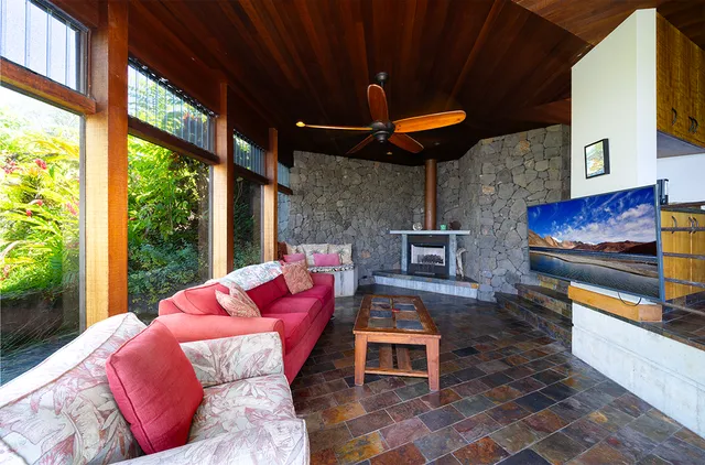 a outdoor space with lots of furniture and a fireplace