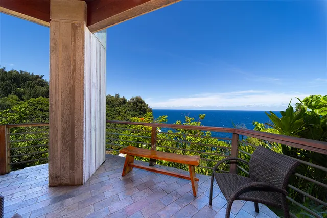 a view of a chairs and table in a balcony