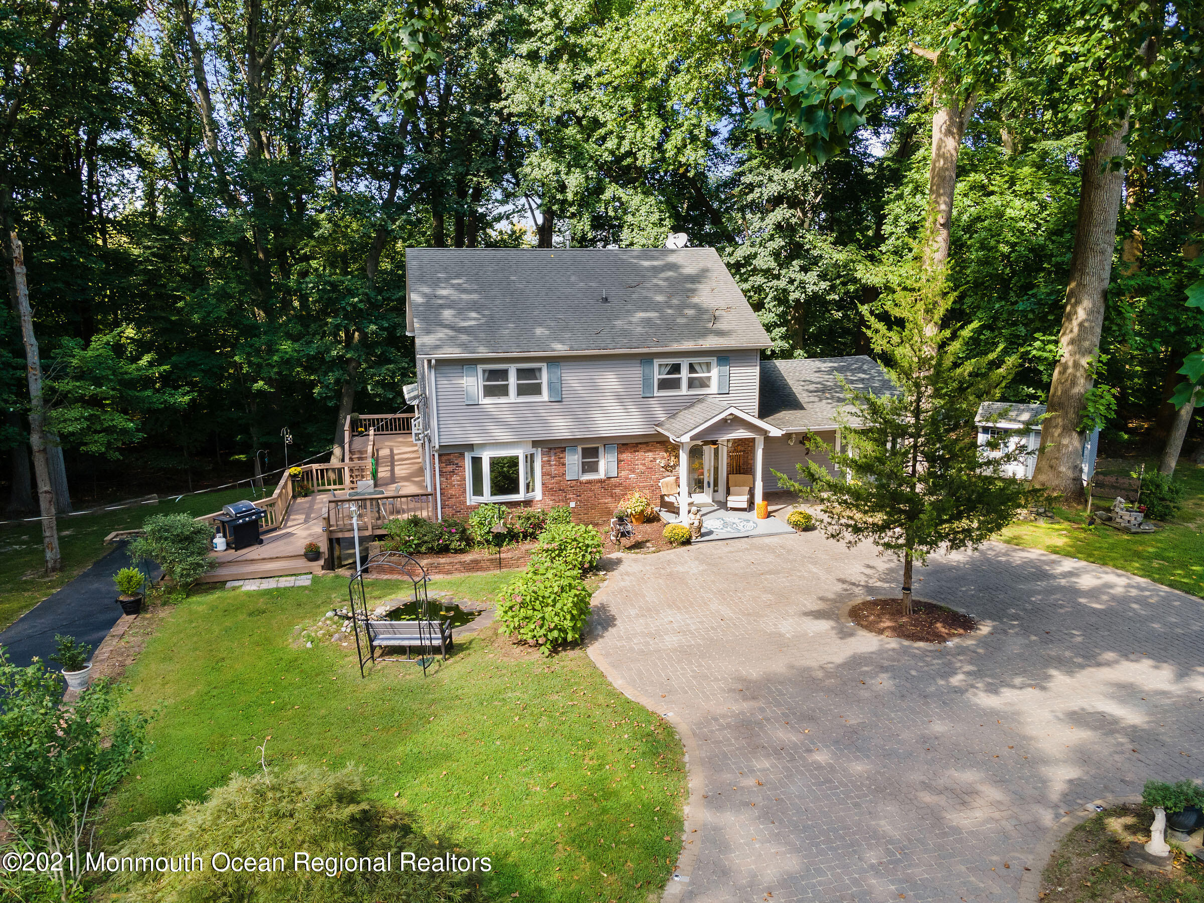 88 Beechwood Road Lincroft, NJ 07738 - Photo 2 of 33 a front view of a house with garden