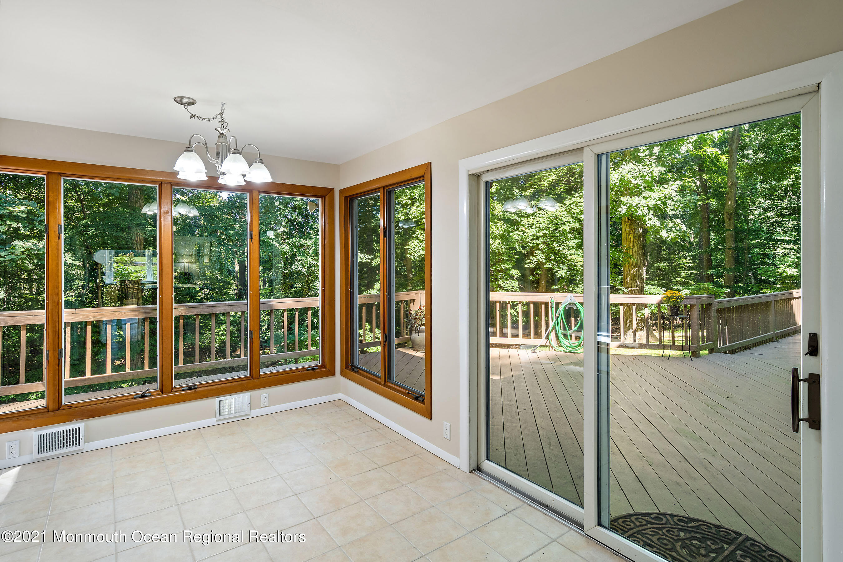 88 Beechwood Road Lincroft, NJ 07738 - Photo 11 of 33 a very nice looking room with a large window and an outdoor view
