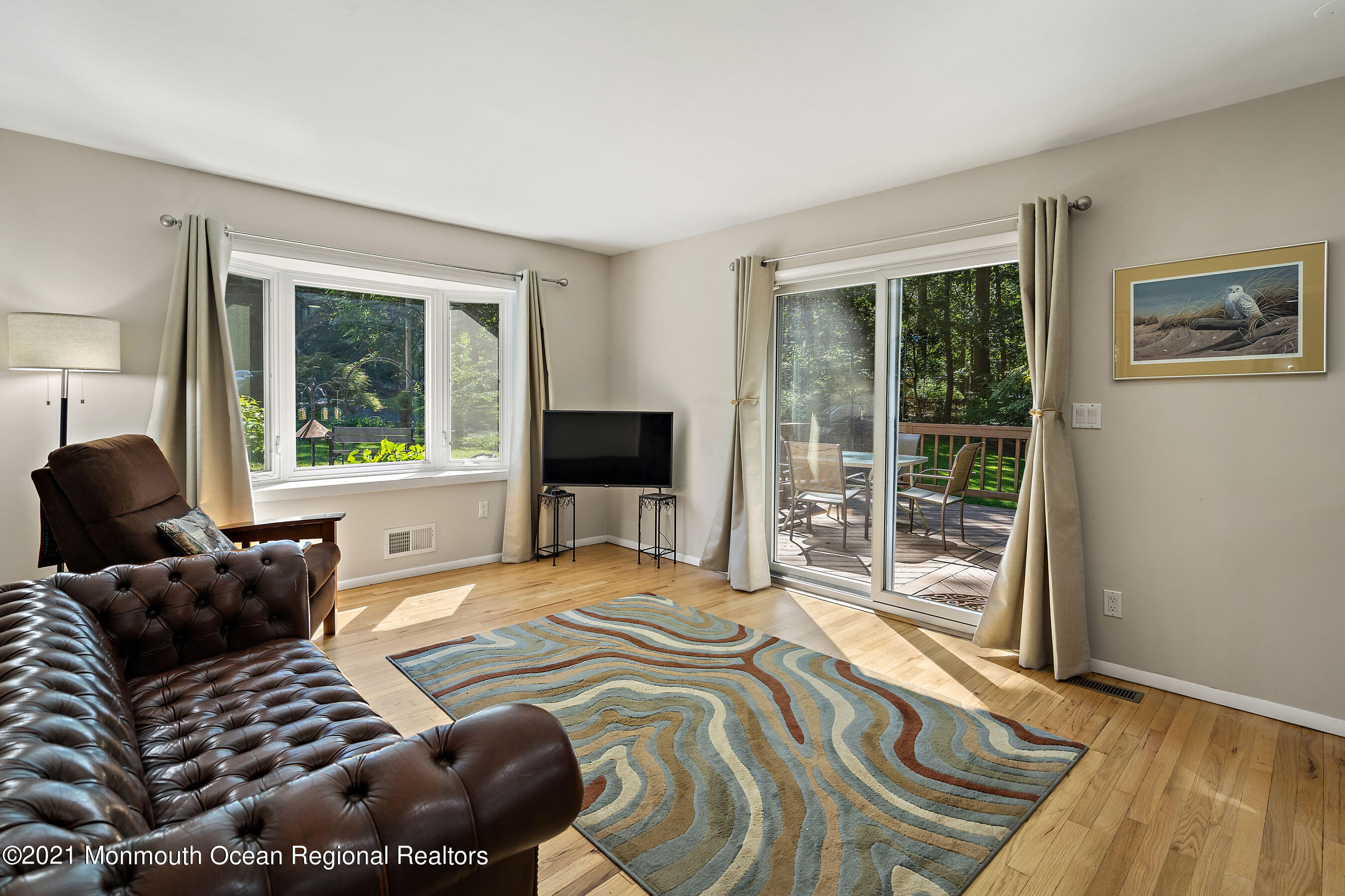 88 Beechwood Road Lincroft, NJ 07738 - Photo 12 of 33 a bedroom with a bed and wooden floor