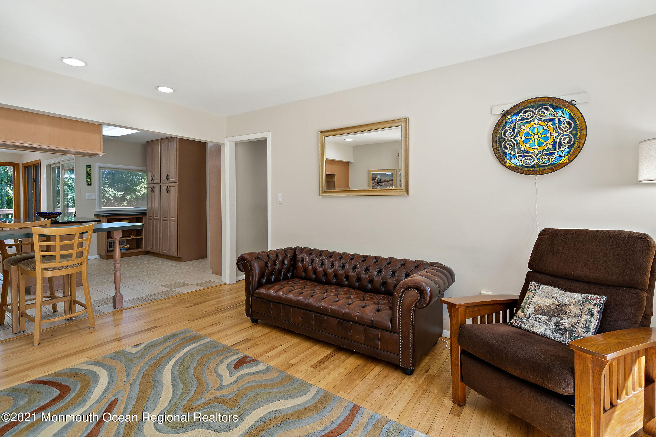 88 Beechwood Road Lincroft, NJ 07738 - Photo 14 of 33 a living room with furniture and a wooden floor