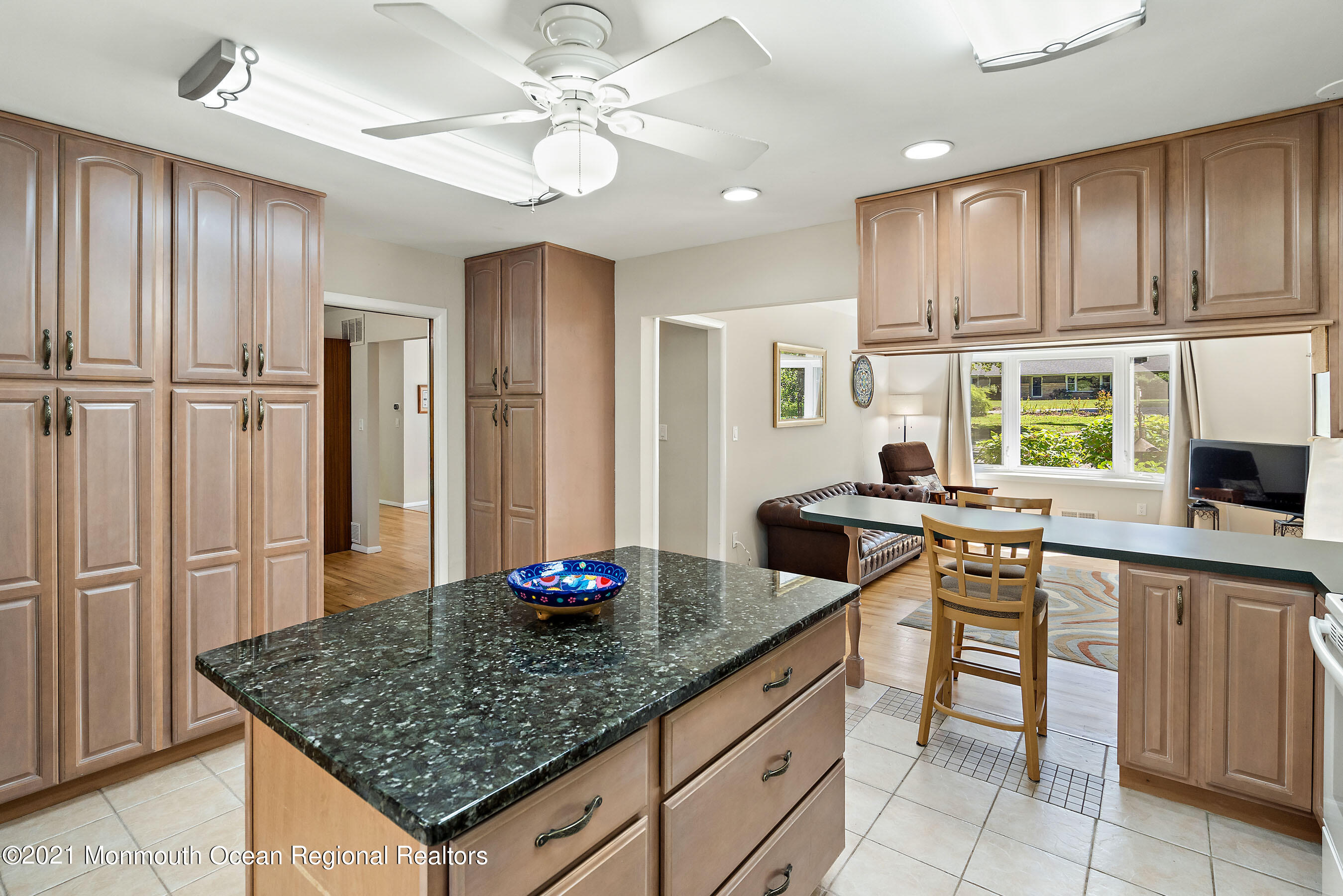 88 Beechwood Road Lincroft, NJ 07738 - Photo 15 of 33 a kitchen with stainless steel appliances granite countertop a sink refrigerator and cabinets