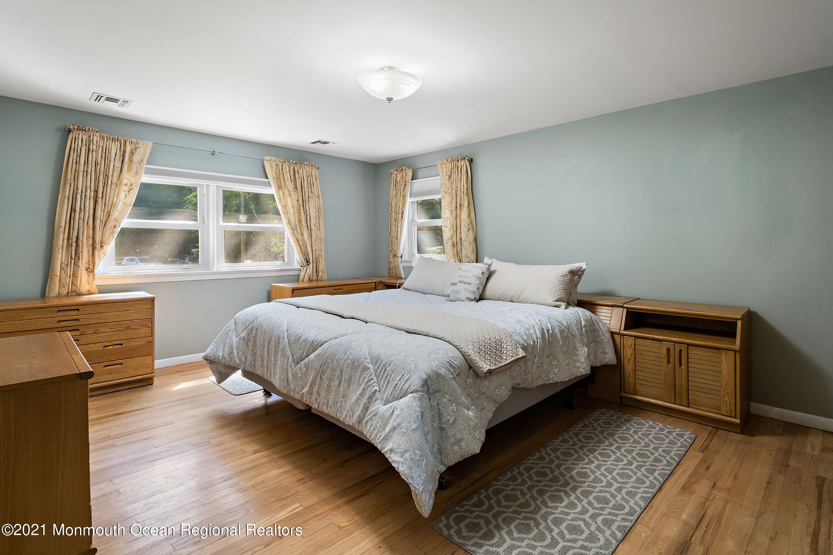 88 Beechwood Road Lincroft, NJ 07738 - Photo 20 of 33 a bedroom with a bed and wooden floor