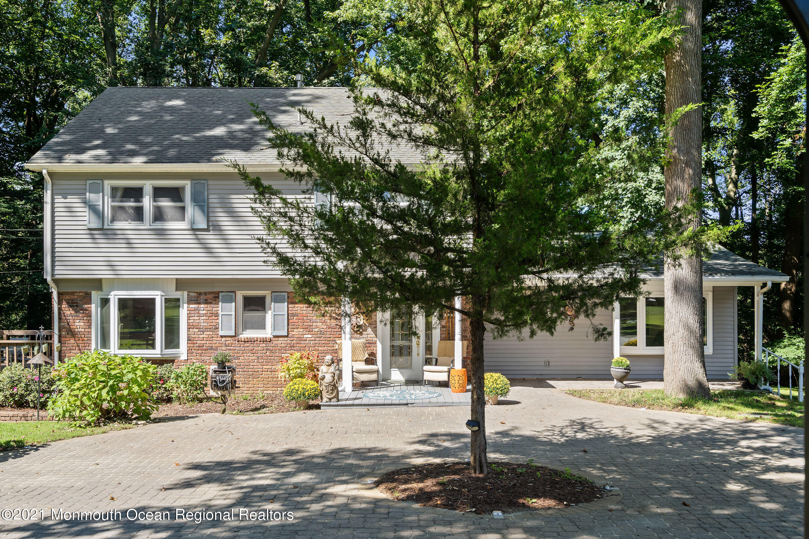 88 Beechwood Road Lincroft, NJ 07738 - Photo 3 of 33 a front view of a house with a tree